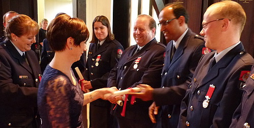 Members receiving their certificates
